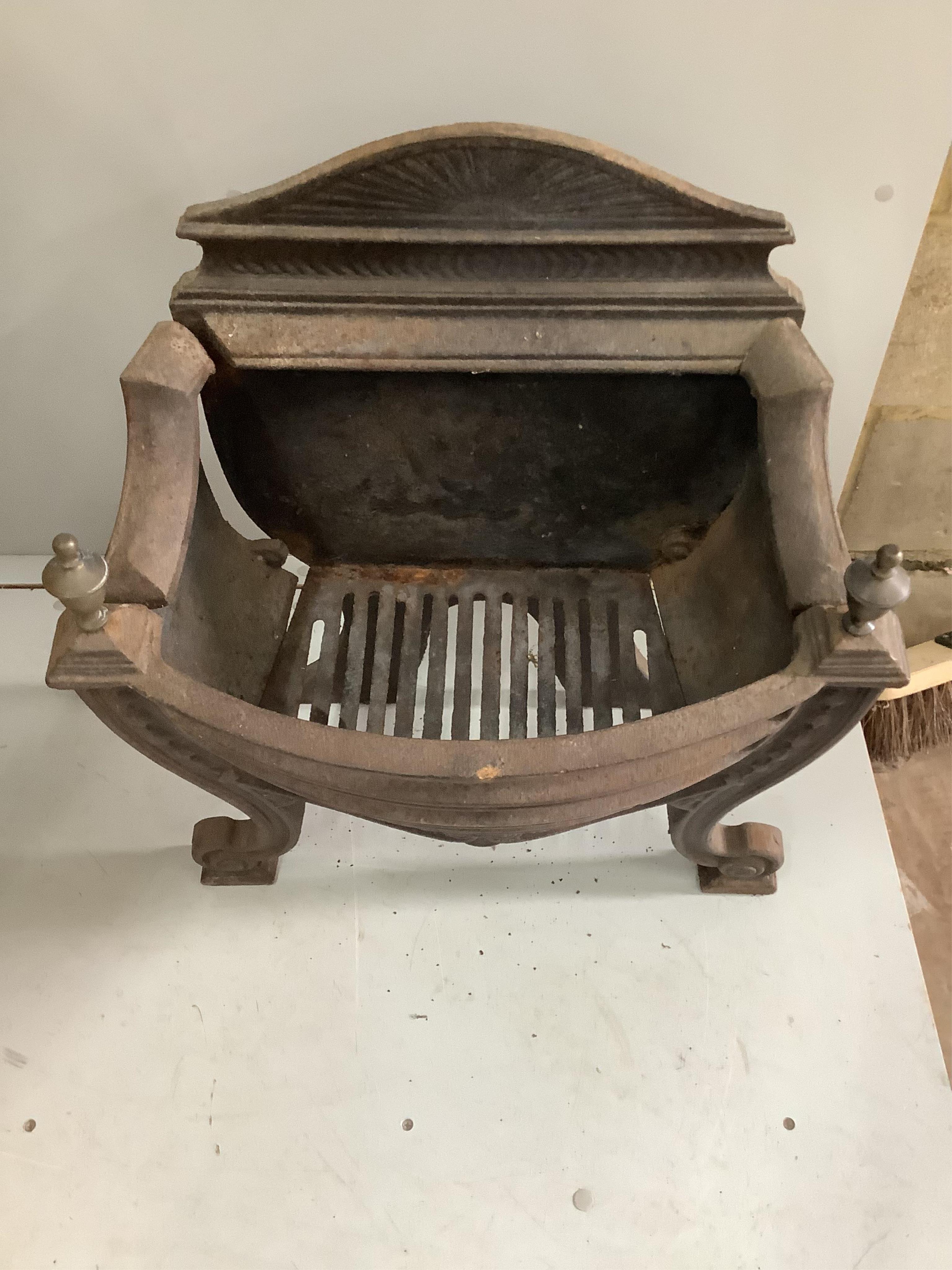 A George III style brass mounted cast iron serpentine fire grate, (lacking side bolts), width 56cm, depth 30cm, height 64cm. Condition - poor